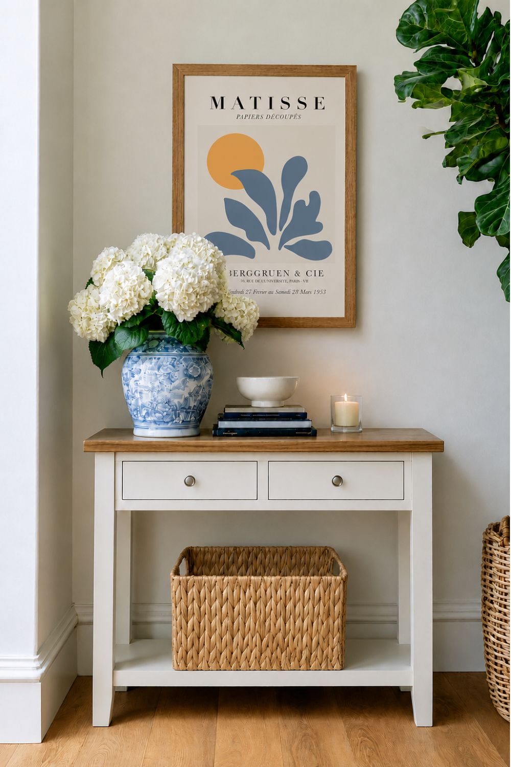 Blue and white entryway styling with sage green console table, blue and white vase and white hydrangeas